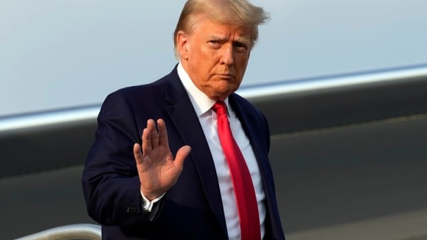 Trump surrenders to Georgia officials on charges he tried to overturn the state's 2020 election result