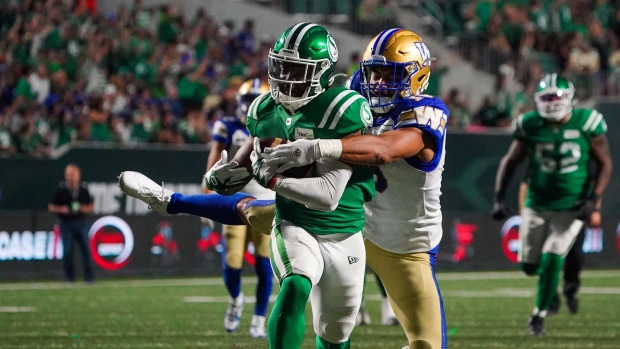Blue Bombers drop Labour Day Classic in overtime battle; Saskatchewan Roughriders running back Jamal Morrow \(25\) is tackled by Winnipeg Blue Bombers linebacker Kyrie Wilson \(19\) during overtime of CFL Labour Day Classic football action in Regina, Sunday, Sept\. 3, 2023\. 