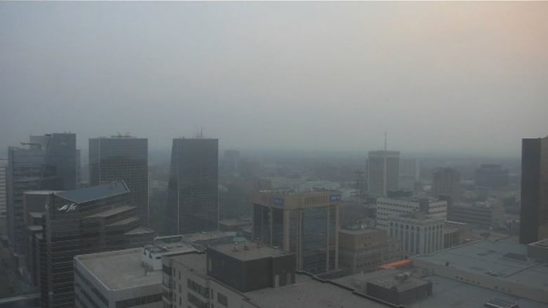 Tall buildings in Regina's downtown are slightly less visible due to a haze blanketing the air and sky over the city.