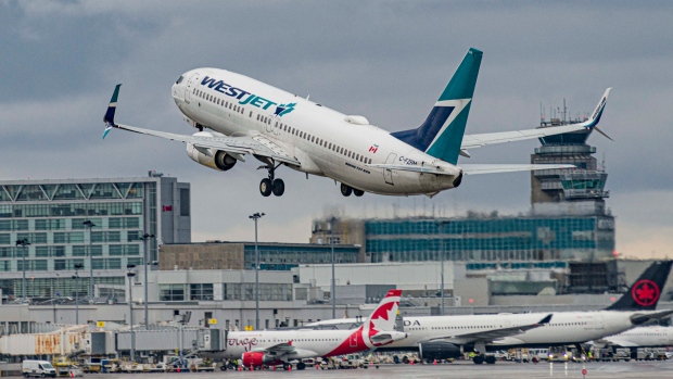 Thousands affected after WestJet cancels flights in anticipation of mechanics strike; Westjet flight at Montreal-Trudeau Airport on April 24, 2023\. 