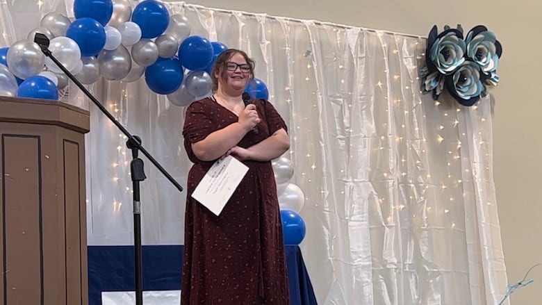Regan Morningstar speaks to the crowd