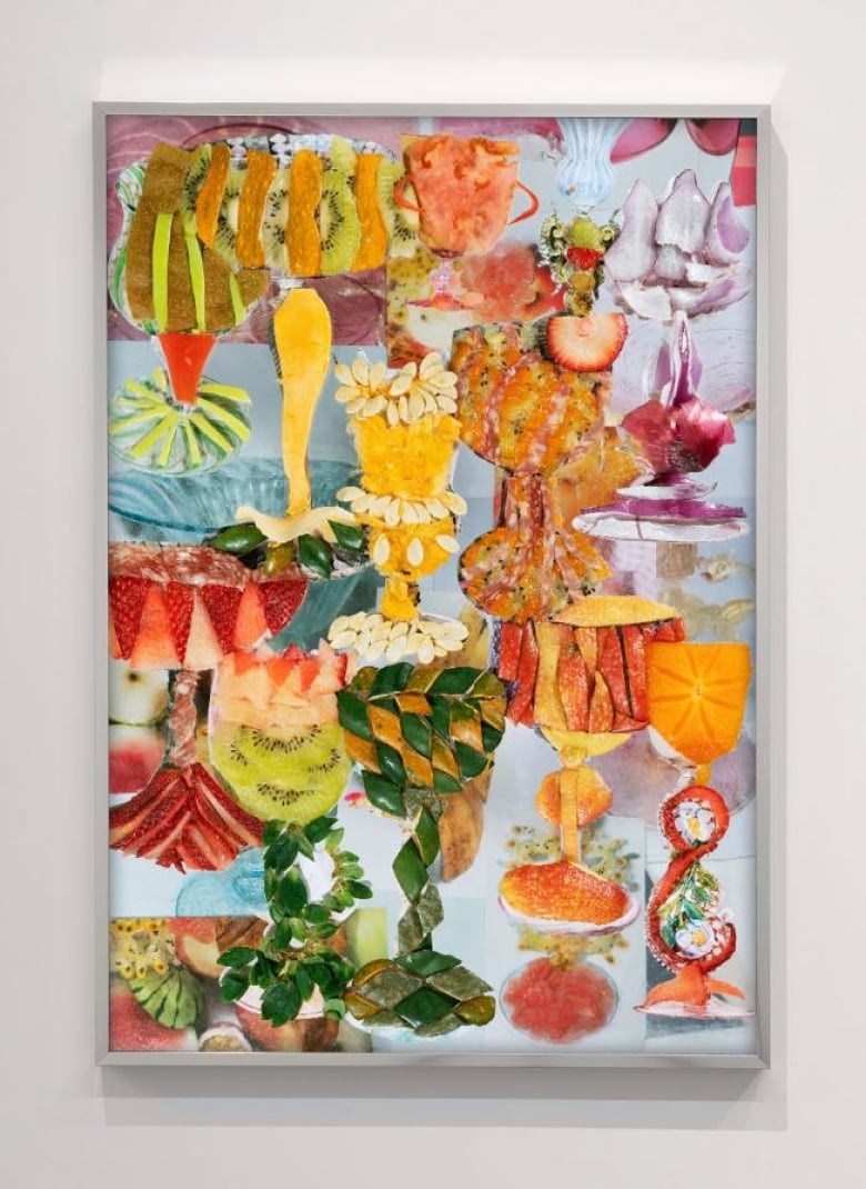 Framed artwork on a white wall. The piece is a colourful collage of food photos reassembled to create the shape of goblets and vessels that seem both familiar and surreal.