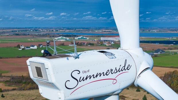 Summerside Wind Turbines having work done to them. Two-person crew on top of the turbines plus some generic shots A person atop a wind turbine that's being maintained in Summerside, P.E.I.