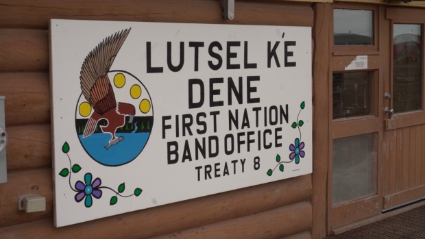 Łutsel K'e Dene First Nation seeks damages on lawyers as part of ongoing Denesoline lawsuit; A sign on a building says Lutsel K'e Dene First Nation band office treaty 8\.