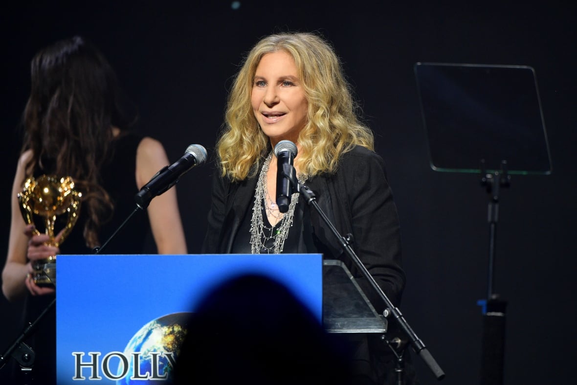 Woman stands at a podium