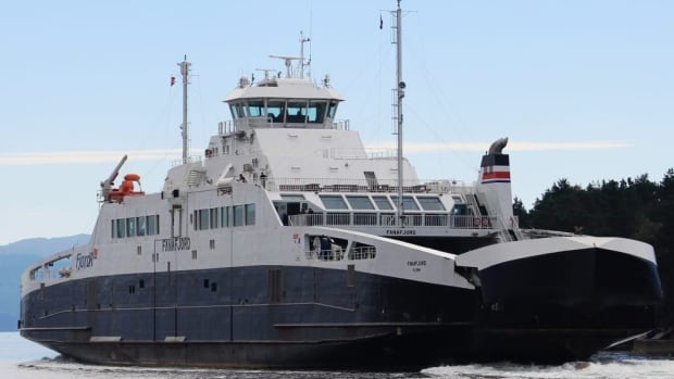MV Fanafjord, launched in 2007, in a photo from the Public Services and Procurement Canada Facebook page. A large ferry with its nose cone opening to let vehicles drive off is shown approaching a dock.