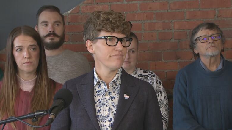 NDP housing critic Janis Irwin stood with Calgary renters while speaking about her proposed bill introduced in the Alberta legislature on Tuesday. 