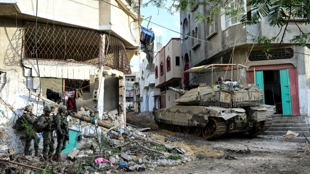 Canada supports UN resolution calling for ceasefire in Israel-Hamas war; Israeli soldiers operate with a tank at the Shajaiya district of Gaza city amid the ongoing conflict between Israel and the Palestinian Islamist group Hamas, in the Gaza Strip December 8, 2023\.  REUTERS/Yossi Zeliger ISRAEL OUT\. NO COMMERCIAL OR EDITORIAL SALES IN ISRAEL\. EDITOR'S NOTE: REUTERS PHOTOGRAPHS WERE REVIEWED BY THE IDF AS PART OF THE CONDITIONS OF THE EMBED\. NO PHOTOS WERE REMOVED\.
