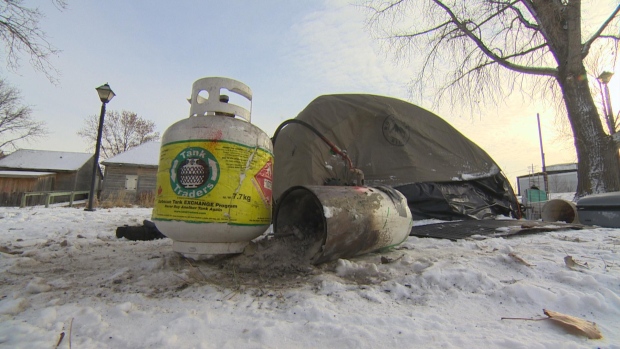 Pair found dead in tent at Point Douglas park sparks fear for homeless as winter looms; A propane tank and gas-powered heater lay on the ground next to the tent in Joe Zuken Park where two people were found dead on Monday\.