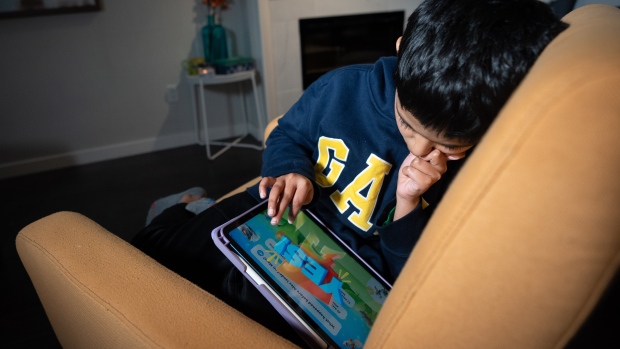 Schooled by AI: What parents should know about the programs reshaping early education; Rohan, 8, plays a LittleLit game on a tablet that uses AI to personalize the learning experience in Coquitlam, B\.C\. 