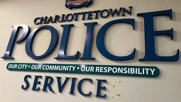 In the report, the investigator says, 'It is clear that police were willing to provide assistance to Mr. Knockwood. However, at the time he was declining help, and there were no current implicit or explicit threats by Mr. Knockwood suggesting that he would do himself harm.' A logo of Charlottetown police, in blue, on the wall of police headquarters.