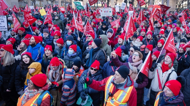 Quebec teachers' union executives approve government proposal; Striking teachers and their supporters hold a rally in front of Premier Francois Legault's office, Friday, Dec\. 22, 2023 in Montreal\. THE CANADIAN PRESS/Ryan Remiorz