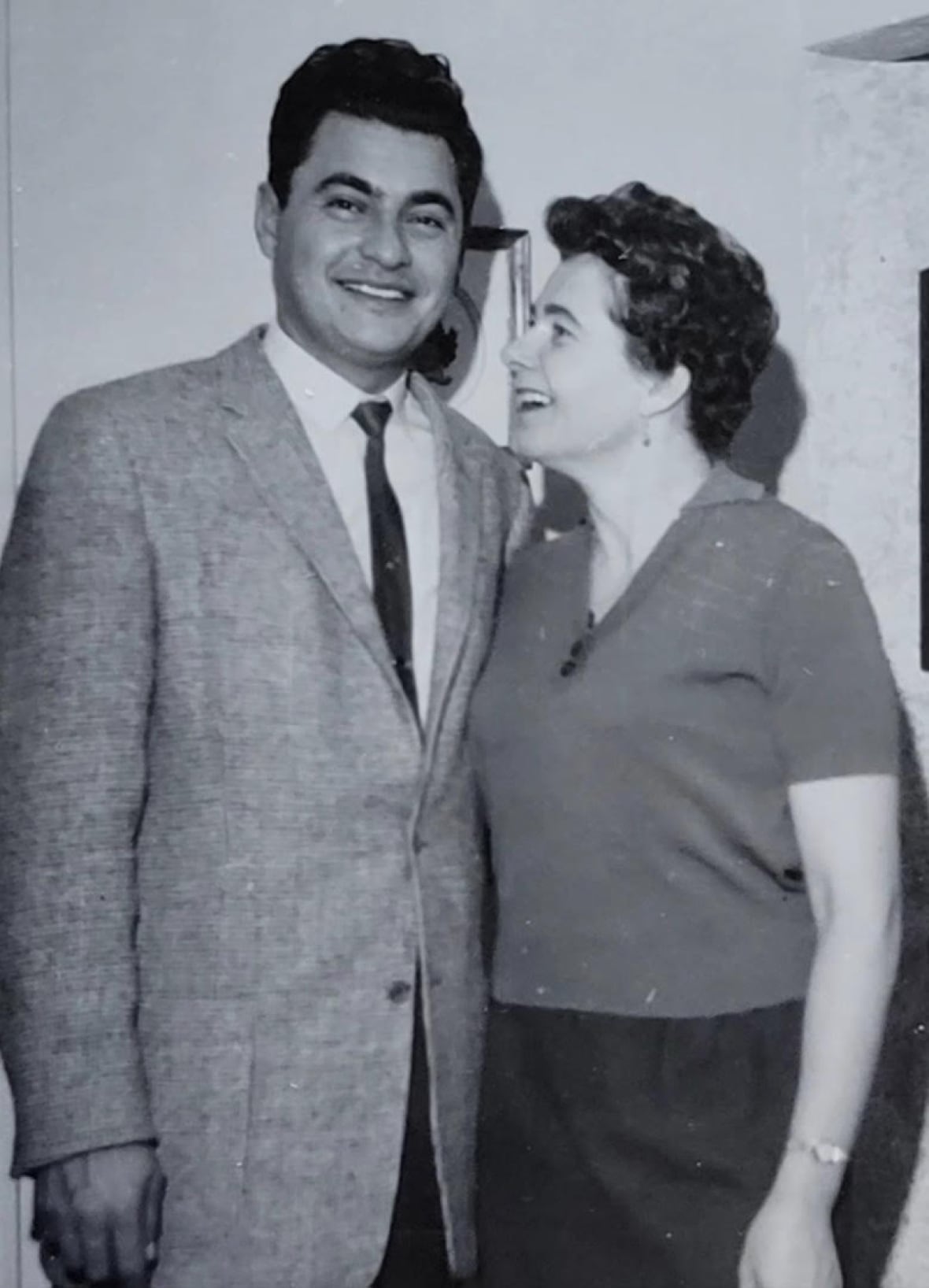 A man and a woman in a black and white photo.