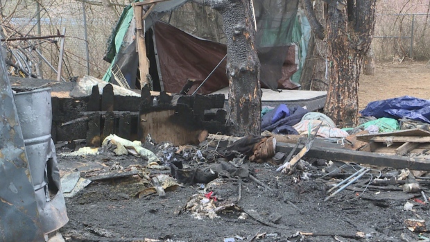 Man dead after fire at Saint John encampment; Burnt remains at the scene of a fire, that claimed one life, at a homeless encampment in Saint John\.