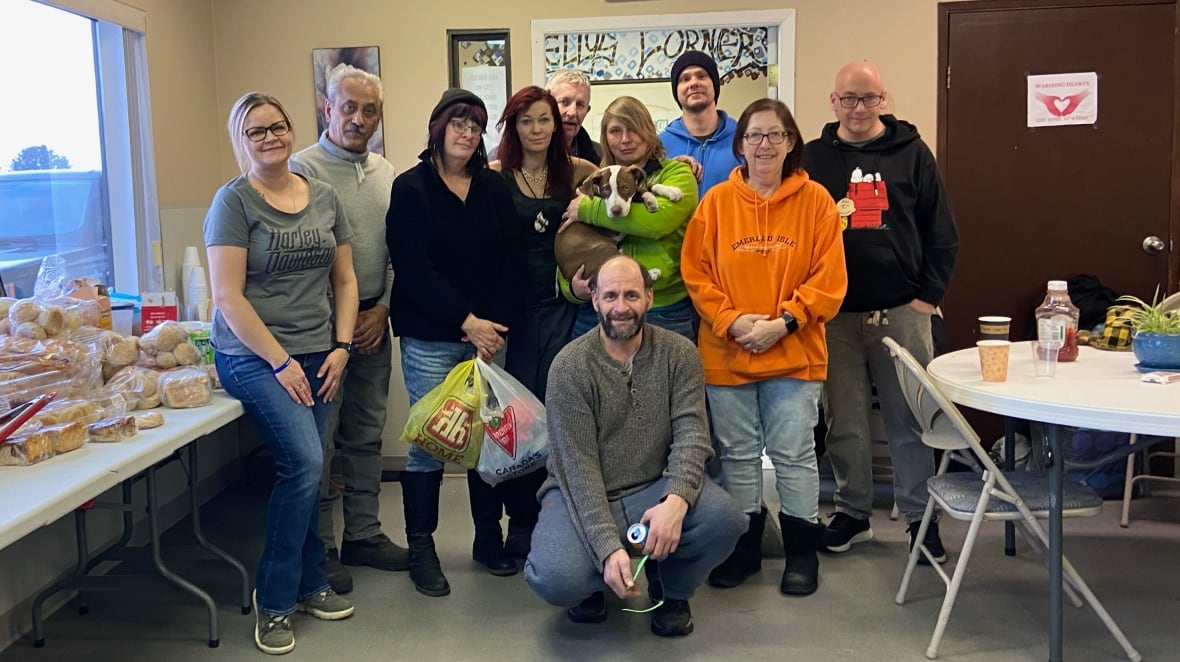 Group picture of Drayton Valley's close-knit homeless community at Warming Hearts Centre.
