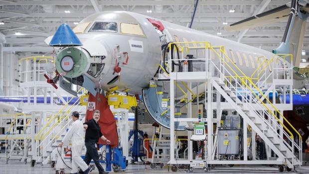 Unifor says 1,350 of its members are on strike at Bombardier after deal deadline passes; Bombardier workers assemble a Global 7500 business jet at the company's Mississauga, Ont\., plant on Jan\. 22, 2024\.