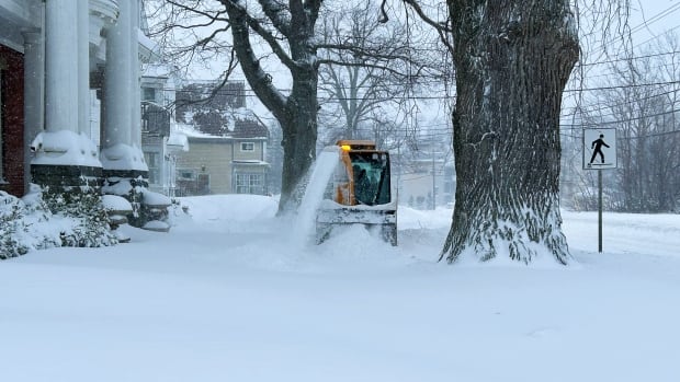 Plows were out clearing roads and sidewalks in Charlottetown Sunday morning. Plow clearing sidewalks