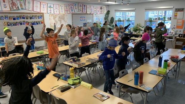 Sask. teacher strikes have made 'class complexity' a hot topic. How might it affect your local school?; With nearly 1,100 students enrolled in Edmonton's Dr\. Margaret-Ann Armour school, access to the gymnasiums is limited\. Grade 4 students take an activity break in their crowded modular classroom on Dec\. 6, 2023\.
