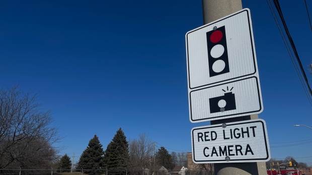 City of Saint John wants to look at 'business case' for installing red light cameras; A sign warns drivers that a red light camera is operating at the intersection\.