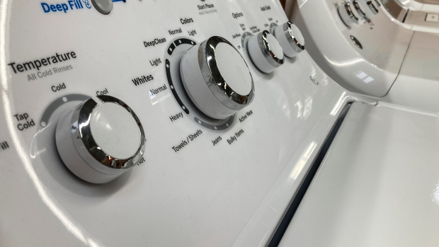 Consumers will ultimately pay the price for Quebec's new language rules, experts say; General Electric washing machines are displayed at a retailer, Friday, Sept\. 15, 2023, in Marietta, Ga\. On Tuesday, the Conference Board reports on U\.S\. consumer confidence for September\. \(AP Photo/Mike Stewart\)