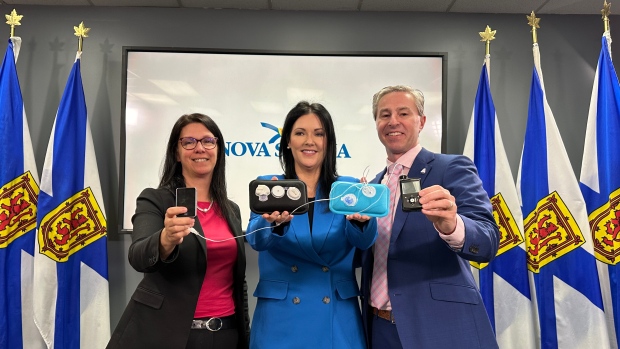 Province to pay for continuous glucose monitors, lift age cap on insulin pumps; Health Minister Michelle Thompson, Maria Campbell of Diabetes Canada, and Premier Tim Houston at an announcement that Nova Scotia will pay for continuous glucose monitors and lift the age cap on coverage for insulin pumps, Feb\. 28, 2024\.