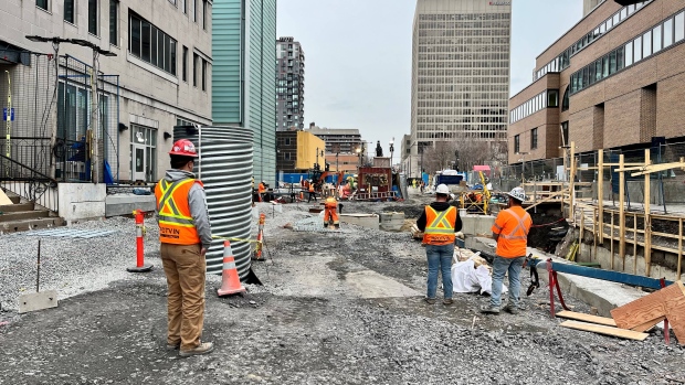 Construction near Berri-UQAM delayed after almost 2 years of work. What's taking so long?; Construction workers at the Berri-UQAM site\. 