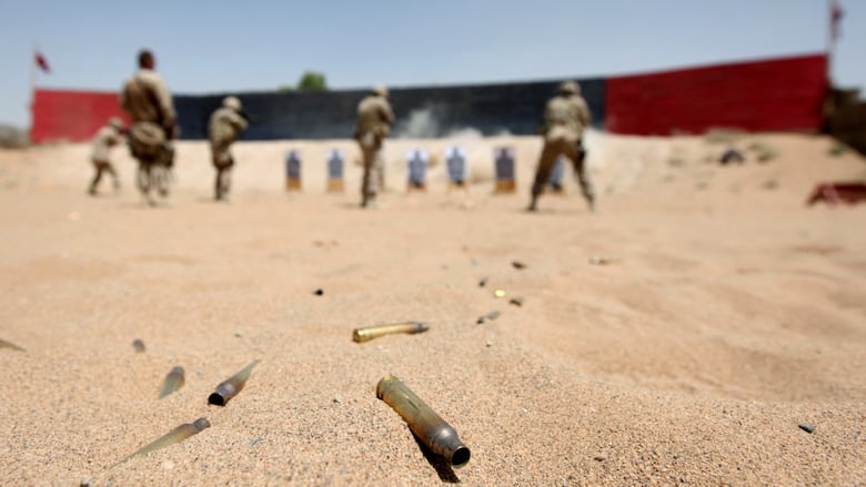 Cartridges lie in the sands as Canadian Task Force Kandahar soldiers take part in a shooting exercise at Camp Nathan Smith in Kandahar city on June 7, 2010. NATO, US and Afghan troops are preparing their biggest offensive against the rebels in the southern province of Kandahar, with foreign troop numbers set to peak at 150,000 by August.