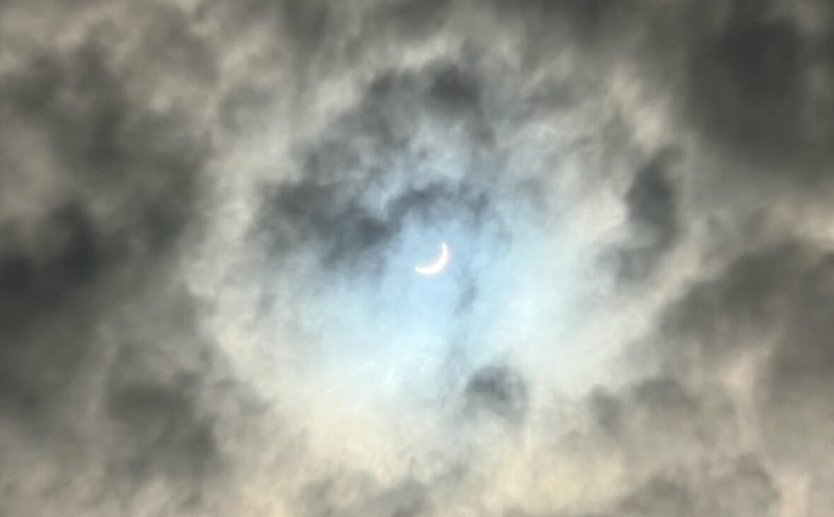 This photo of the eclipse was taken by Mississauga resident Natalie Senior from her driveway. She says she works at home and just popped out to get a photo. 'I was in awe. It's a piece of history. And I was glad to capture such a sight. It's a split second photo. I caught it just in time.'