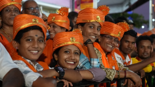Modi's Hindu-first approach makes him a god to some Indian voters — and a danger to others; Supporters cheer at Modi rally 
