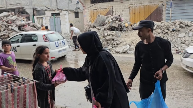 Yellowknife coffee shop pays for 900 meals in embattled Gaza; Rami Kassem, the owner of Javaroma in Yellowknife, sent the money to a woman in the city of Rafah who helped organize, prepare and distribute the meals\. Kassem received these photos from her afterward\.