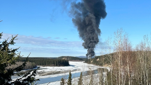 Pilot reported fire on fuel-laden plane and tried to return to airport before deadly Alaska crash; Smoke rises after a Douglas C-54 Skymaster plane crashed into the Tanana River outside Fairbanks, Alaska, Tuesday, April 23, 2024\. The plane took off in the morning from Fairbanks International Airport\. It crashed about 7 miles \(11 kms\.\) from there and 'slid into a steep hill on the bank of the river where it caught fire,' according to Alaska State Troopers\.