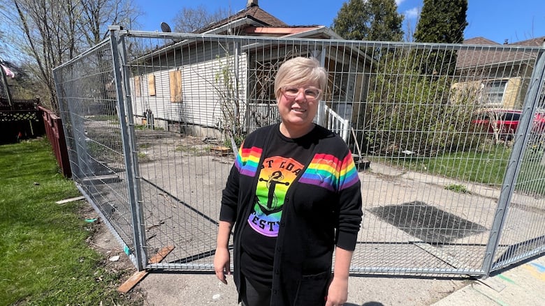 Becky Thompson in front of 19 Redan Street, which the city has ordered to be demolished. Thompson lives right door and her house is up for sale. The city hasn’t confirmed when the demolition will go ahead.
