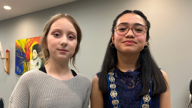 Contest-winning students call the shots on mock Corner Brook city council; Jae-Ana Watkins, left, and Kenna Mangosing were chosen to be deputy mayor and mayor respectively\. They said they had fun being councillors and learned a lot\.