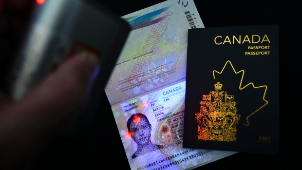 How some young Canadians are saving money by embracing the digital nomad lifestyle; The new Canadian passport is unveiled at an event at the Ottawa International Airport in Ottawa on Wednesday, May 10, 2023\.