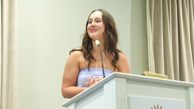 UPEI nursing grads eager to 'make a difference' in health care; Woman standing at podium\.