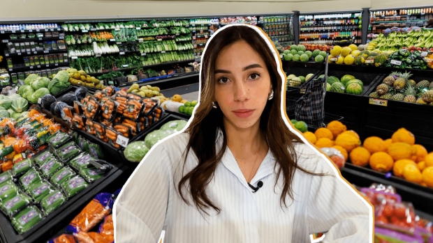 WATCH | Why it's difficult for international low-cost grocers to open stores in Canada; A woman stands in front of a produce section\.