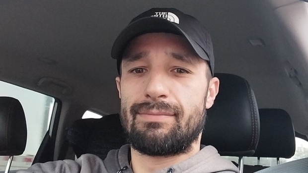 How overcoming hardship helped this Kahnawà:ke hockey coach inspire young players; A selfie of a man wearing a hat in his car\. 