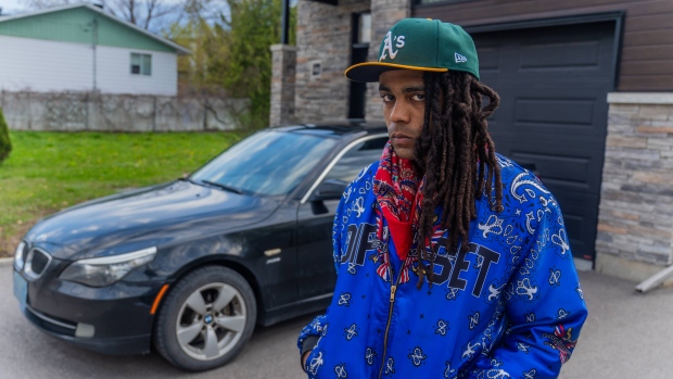 Black man who borrowed father's BMW questioned, forcibly arrested outside home; Khadafi Keenan Fagan-Pierre stands near the spot where he was questioned by police on April 14, with his father's BMW E60 535 in the background\.