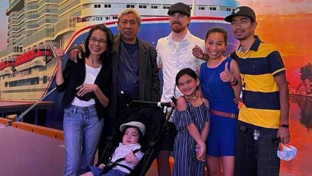 Without extended family support in N.S., newcomers say adjustment can be overwhelming; Alva Bourque, in blue with her husband Robert, in white,  pose with her extended family during a cruise\.