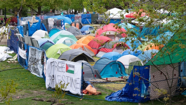 McGill condemns 'alarming' image of armed fighters shared by encampment group; The pro-Palestinian protest encampment on McGill University campus is seen  Monday, May 13, 2024  in Montreal\.