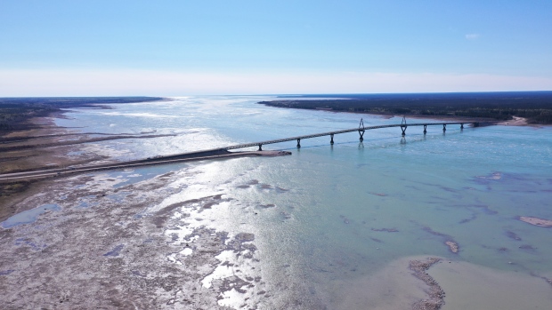 Repairs to N.W.T.'s Deh Cho Bridge begin next week; The Deh Cho bridge linking Fort Providence to the N\.W\.T\. highway system\. Low levels of water can be seen well into the middle of the Mackenzie River\.