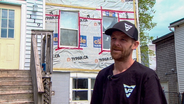 Lack of housing options leaves Saint John family in leaky, mouldy apartment; Cory Hamilton stands in front of the apartment he rents at 119 Guilford St\., Saint John, on May 22, 2024\.