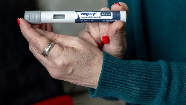 Should Wegovy, the $400-a-month obesity medication, be covered by the provinces?; FILE - Donna Cooper holds up a dosage of Wegovy, a drug used for weight loss, at her home, March 1, 2024, in Front Royal, Va\. The popular weight-loss drug Wegovy may be paid for by Medicare — as long as patients using it also have heart disease and need to reduce the risk of future heart attacks, strokes and other serious problems, federal officials said Thursday, March 21\. \(AP Photo/Amanda Andrade-Rhoades, File\)