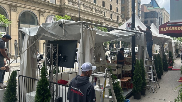 Peel Street businesses can put tents back on terrasses after rough F1 weekend; Fire prevention officers say the issue at hand is around the tent tops which are too close to the buildings making them a fire hazard\. The restaurants can reopen their terrasses if the tents come down\. 