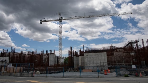 A construction site showing rebar and concrete structures.