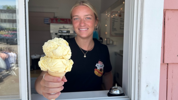 Sundae drive: Islanders keep dairy bars booming on P.E.I.; Hayden MacPherson serves a double scoop of banana ice cream at icy Scoops in Charlottetown\.