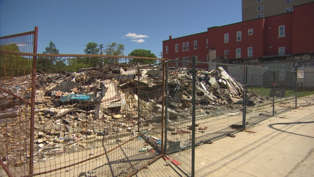 Neighbours fed up with Main Street rubble pile, over a year after fire; This pile of rubble is all that's left after a fire destroyed three businesses, including the Surplus Direct store at 843 Main St\., in February 2023\.