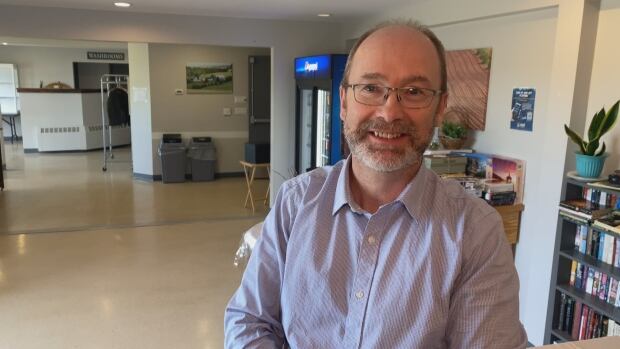 Matt MacFarlane's victory in the District 19 byelection in February gave the Green Party three seats in the legislature, the same number as the Liberals, who hold the status of Official Opposition. Man with light blue shirt and short grey beard.