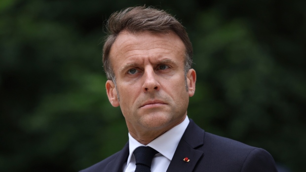 What's at stake for France and its president in Sunday's vote; French President Emmanuel Macron reviews troops that will take part to the Bastille Day parade, Tuesday, July 2, 2024 in Paris\. France will mark Bastille Day on July 14th\.