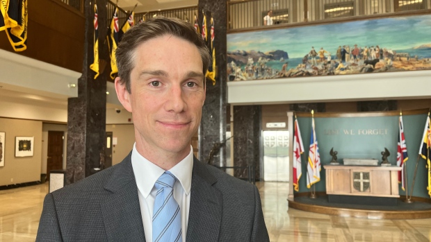Critics say Hogan biting off more than he can chew by taking on health portfolio; John Hogan, N\.L\. minister of justice and public safety and interim health minister, says he is grateful for the opportunity to be the head of the health and justice departments and that he will leave no gaps in either of them\.